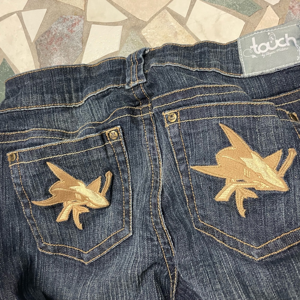 Hello I am selling these jeans for $15 and the brand is Touch by Alyssa Milano.